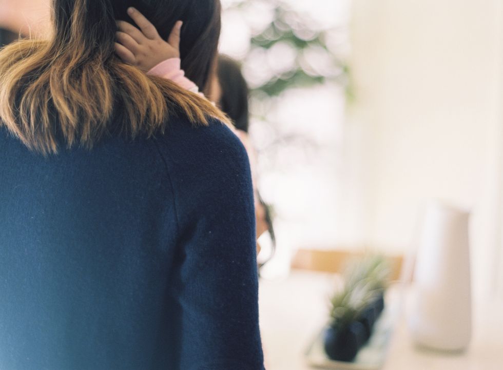 mom hugging child, getting ready for the transition to daycare