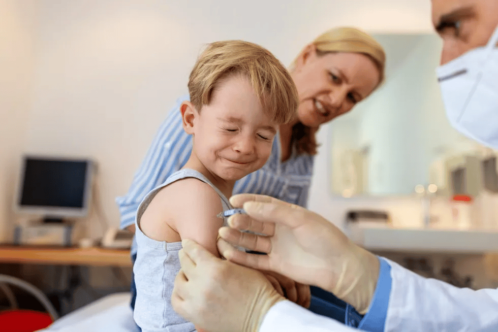 child receiving vaccine