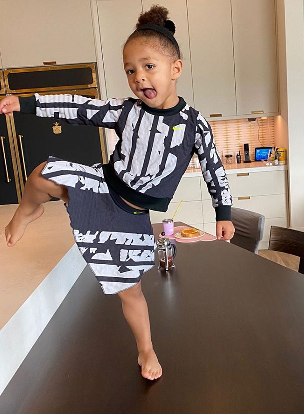 Serena Williams' daughter, Alexis Olympia, models her new tennis outfit.