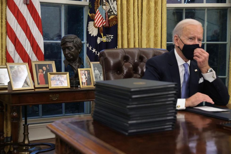 Beau Biden's photo sits behind President Joe Biden in the Oval Office.