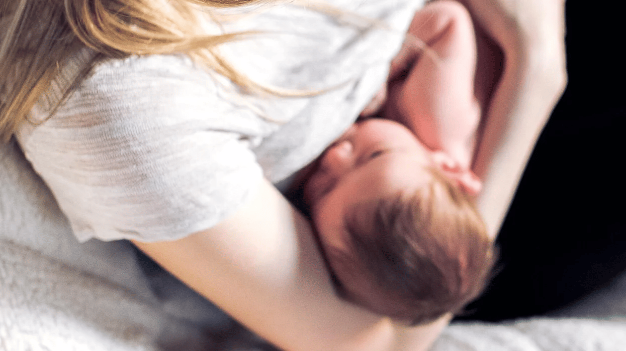 woman breastfeeding a baby - 8-week-old baby feeding schedule