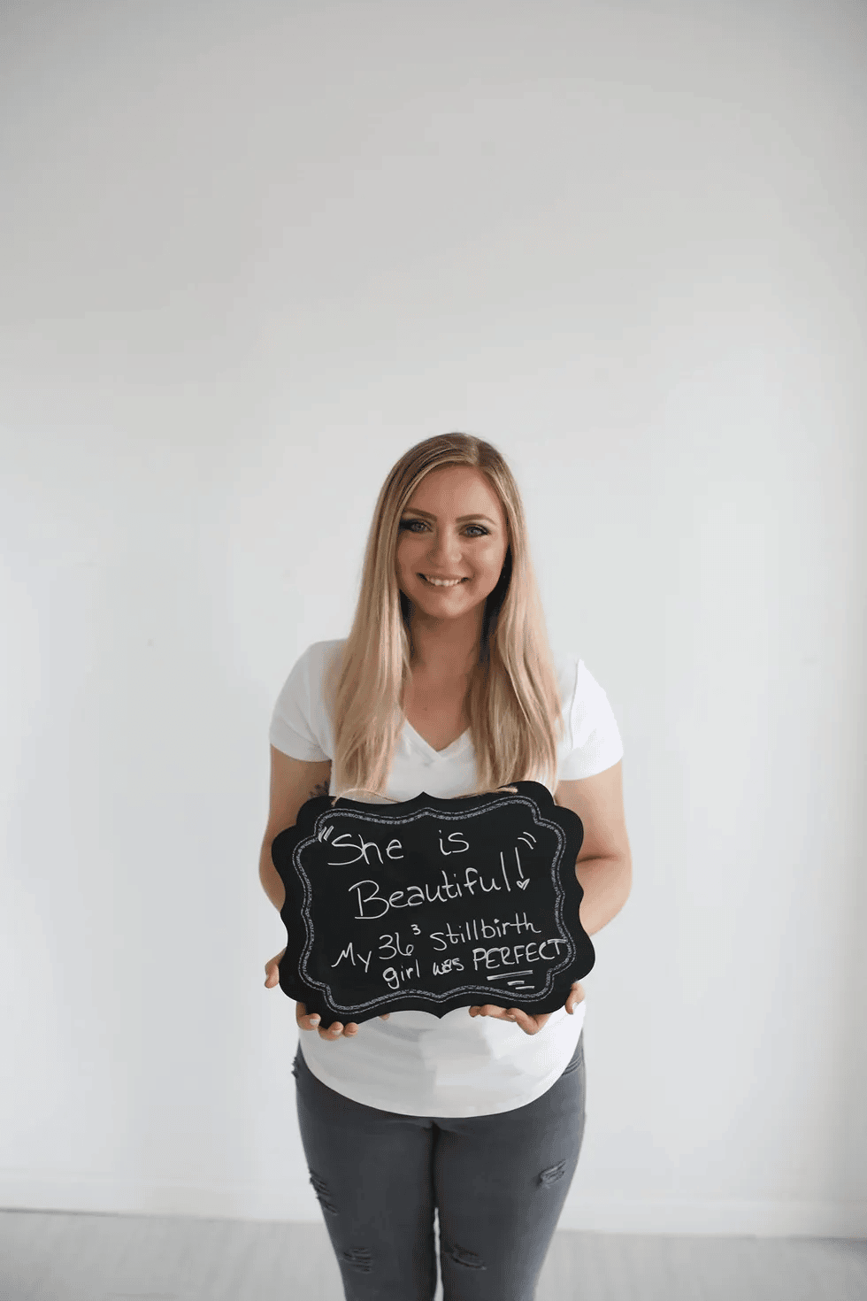 woman-holding-chalkboard-sign
