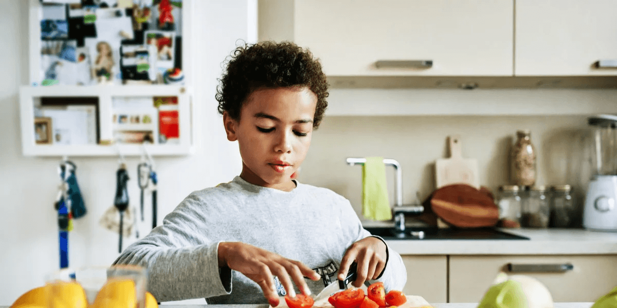 kid-making-food-in-kitchen- vegetarian lunch ideas for kids