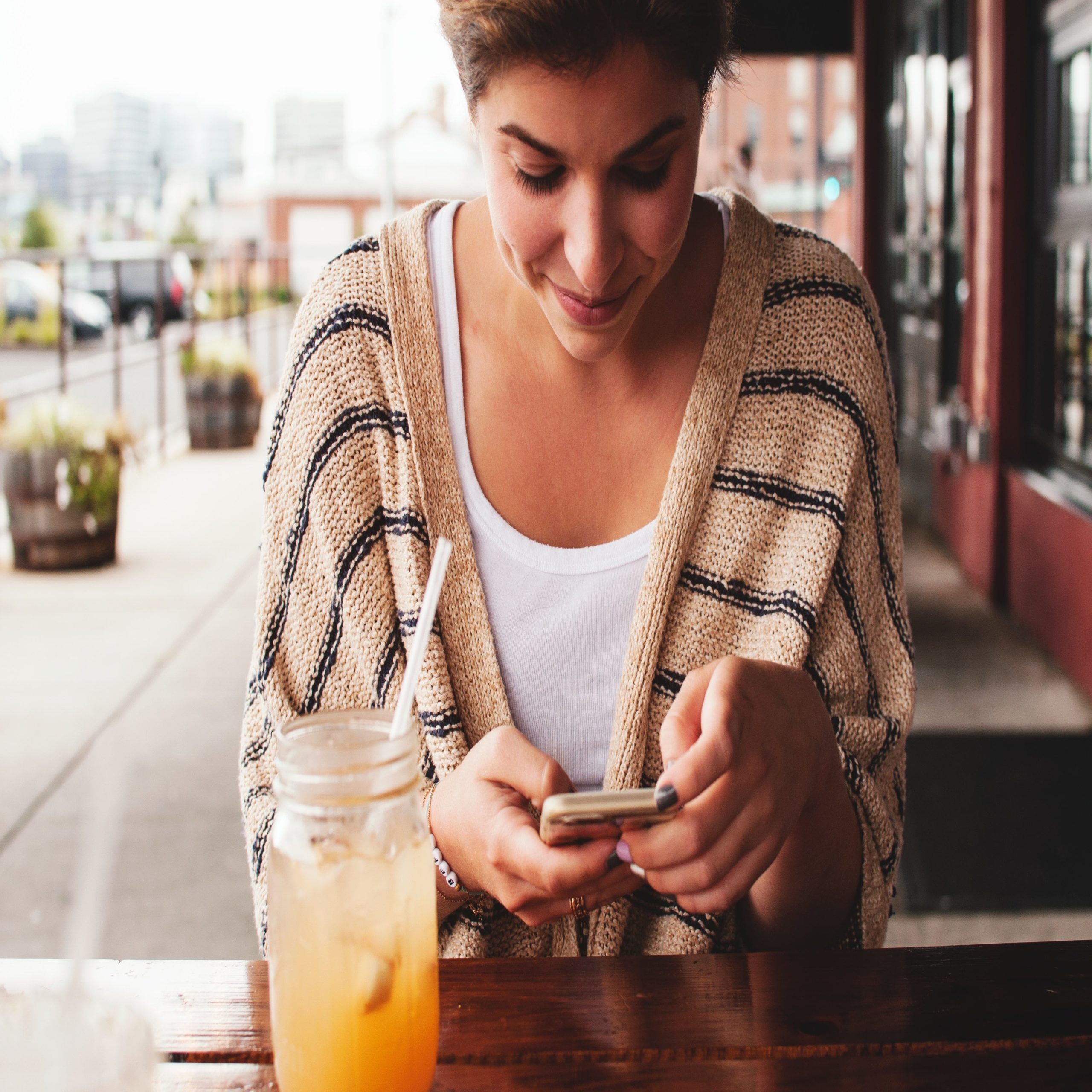 woman on cell phone sitting down