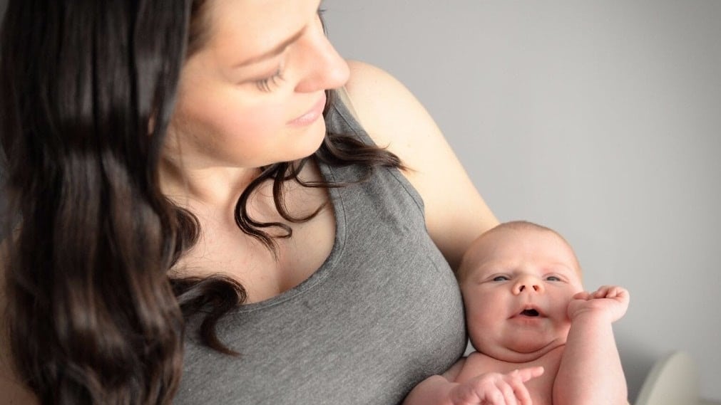 mom snuggling daughter