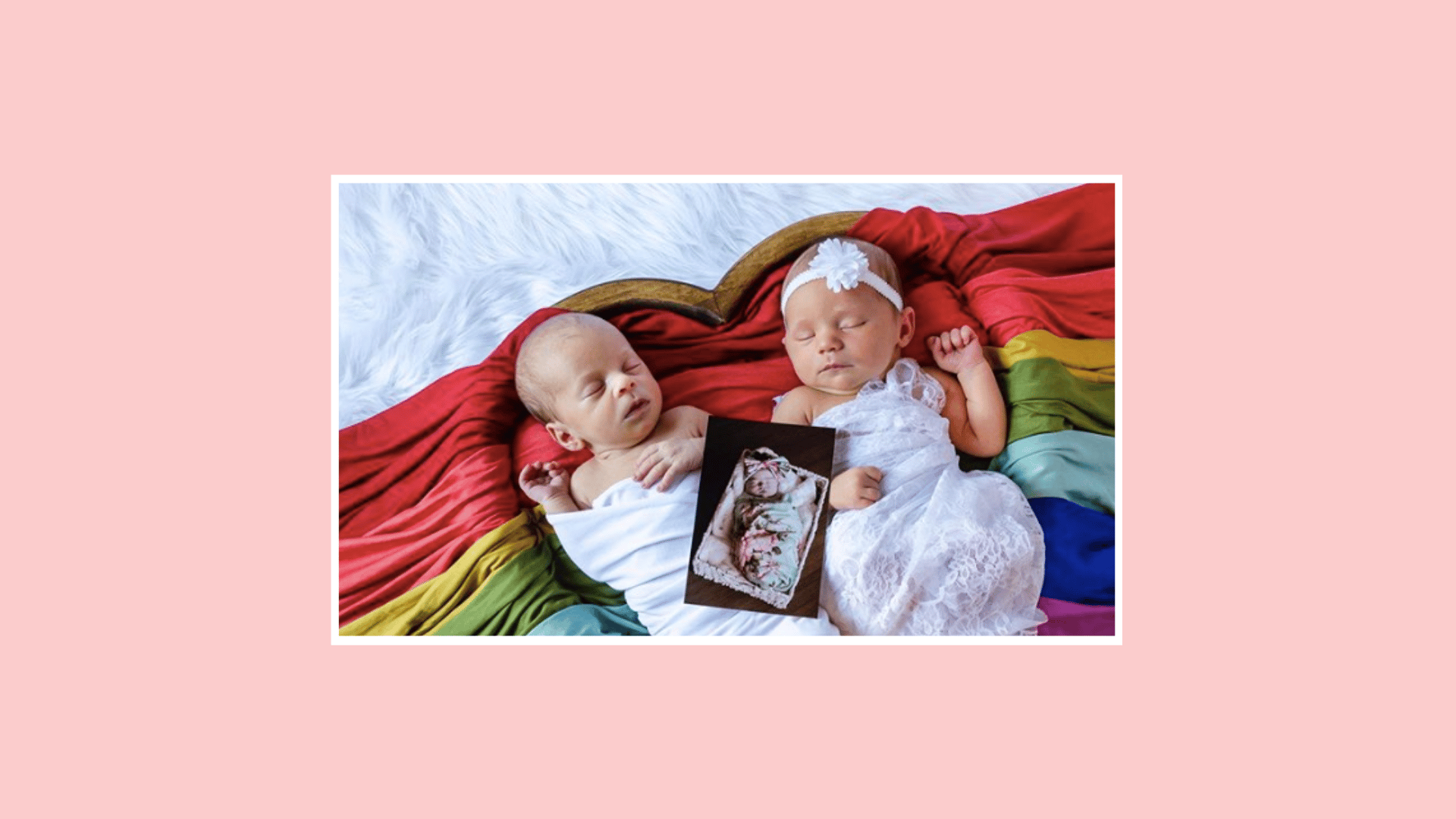 babies with a photo on a rainbow blanket