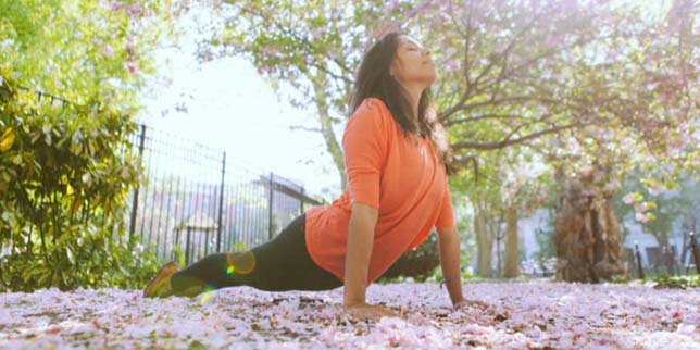 woman doing yoga in the park