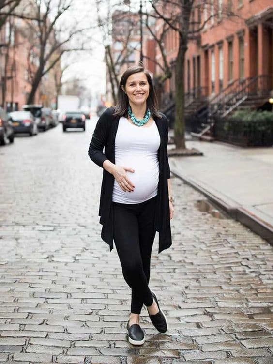 Pregnant woman walking outside