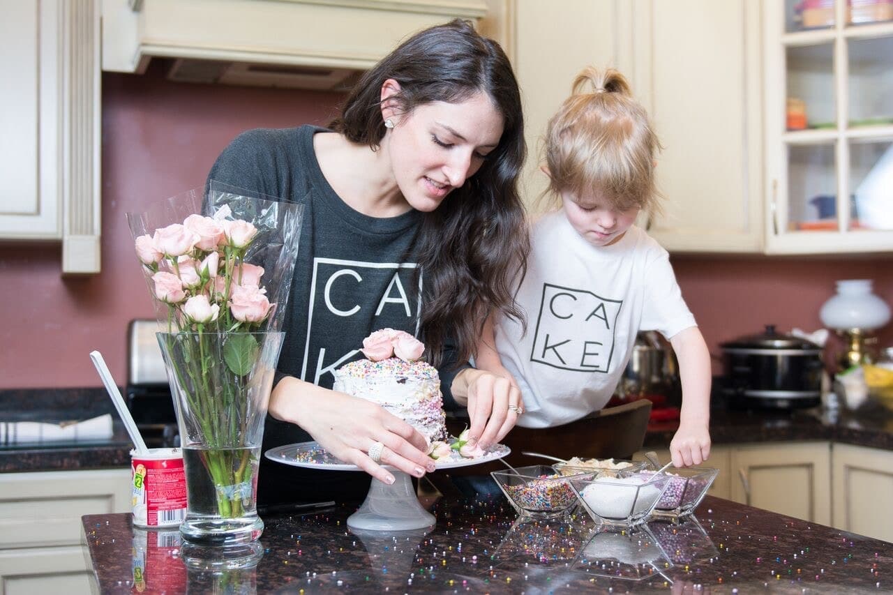 mom baking cake with daughter