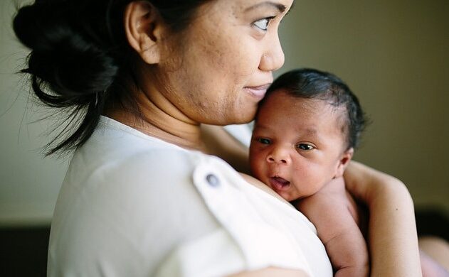 mom holding newborn baby