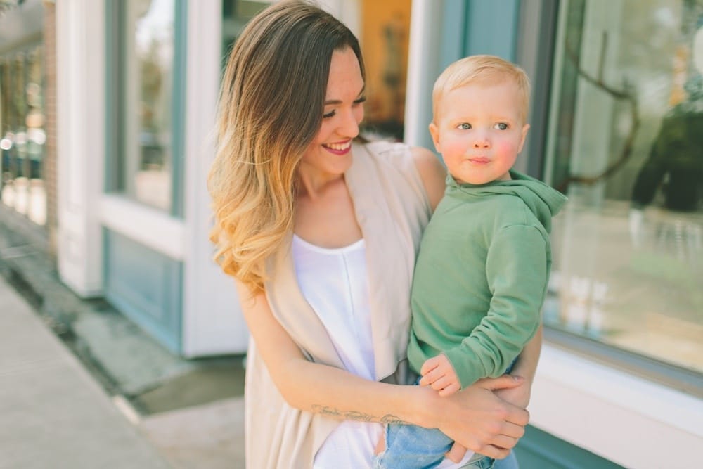 woman holding young toddler