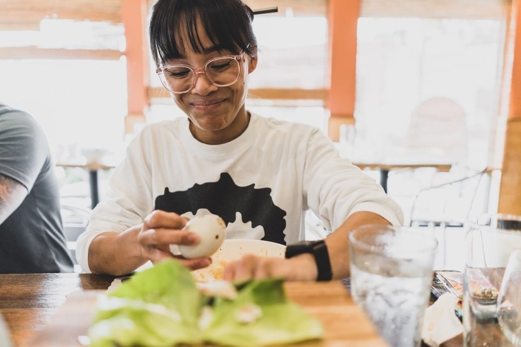 woman peeling cabbage