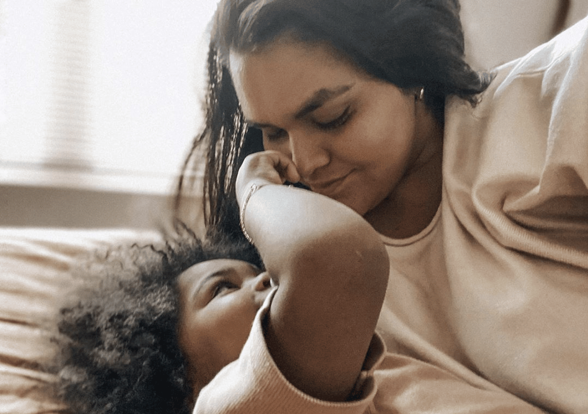 mom looking down at child- indigenous motherhood