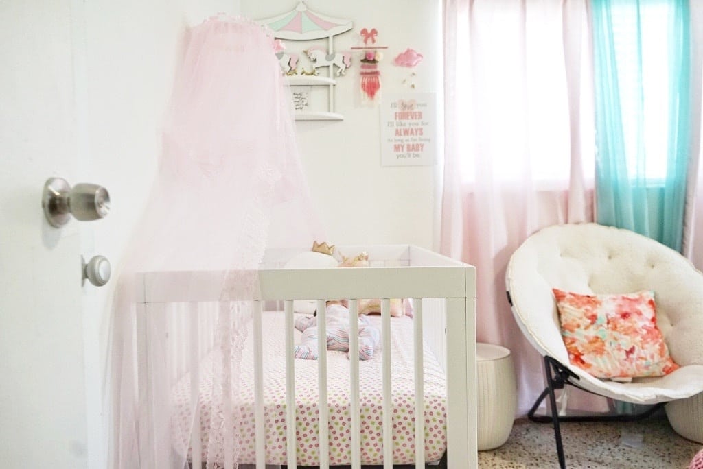 nursery with crib and chair