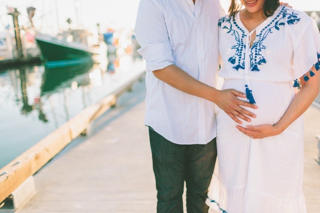 couple walking together on boardwalk