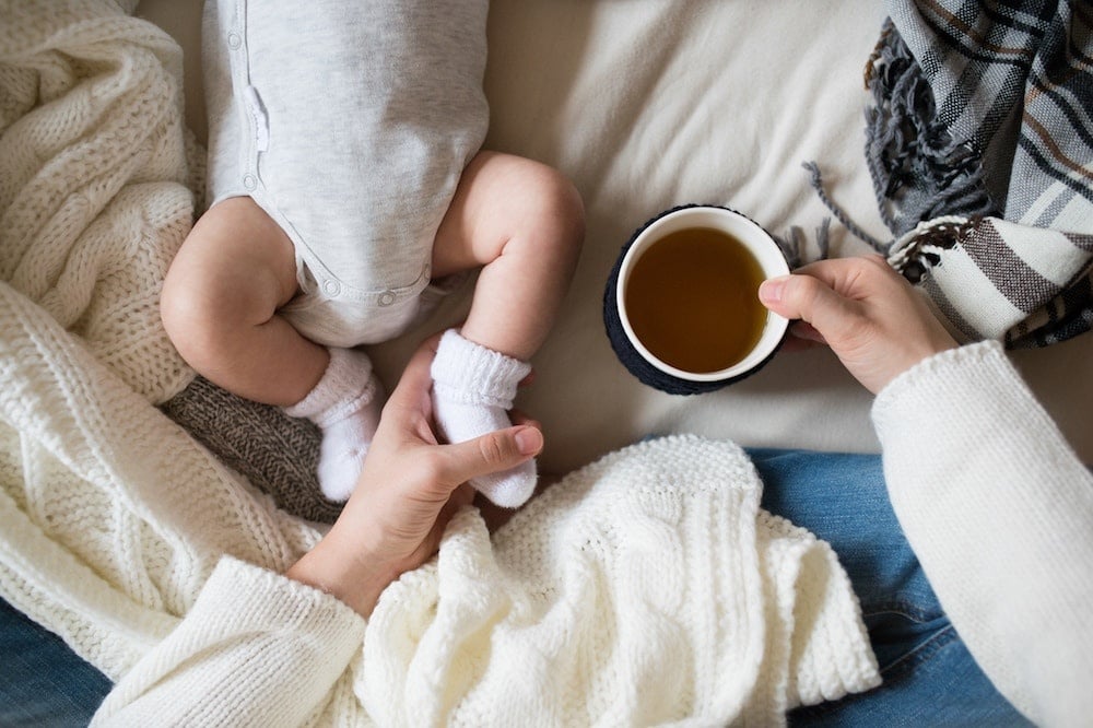 baby in bed with parents