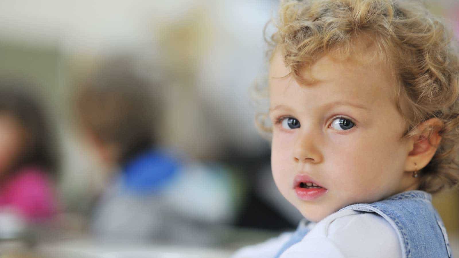 little toddler looking at camera