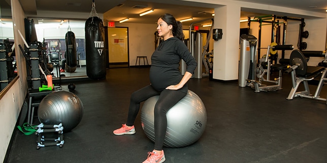 pregnant woman on a yoga ball