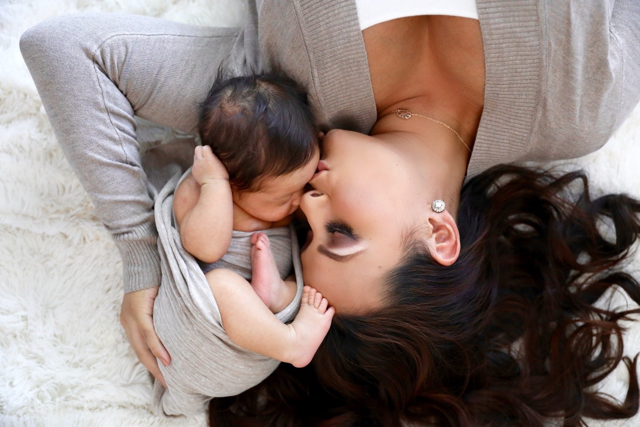 mom kissing swaddled baby- i gave you life but you gave me mine