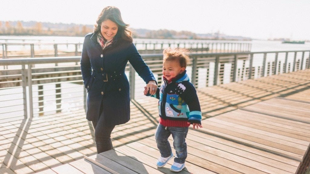 mom taking a walk with her kid