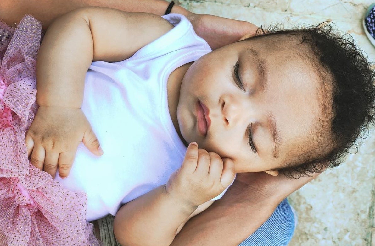 woman holding baby in lap