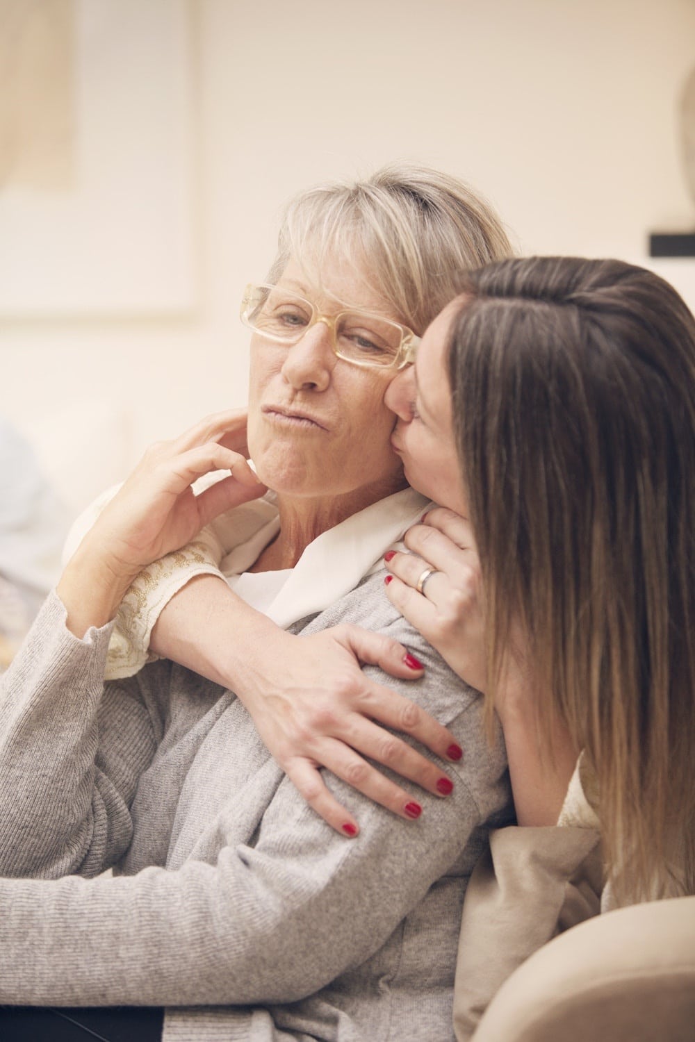 woman kissing mom on the cheek