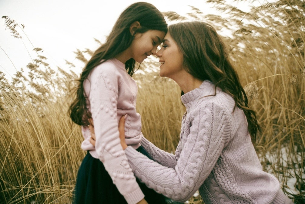 mom comforting daughter