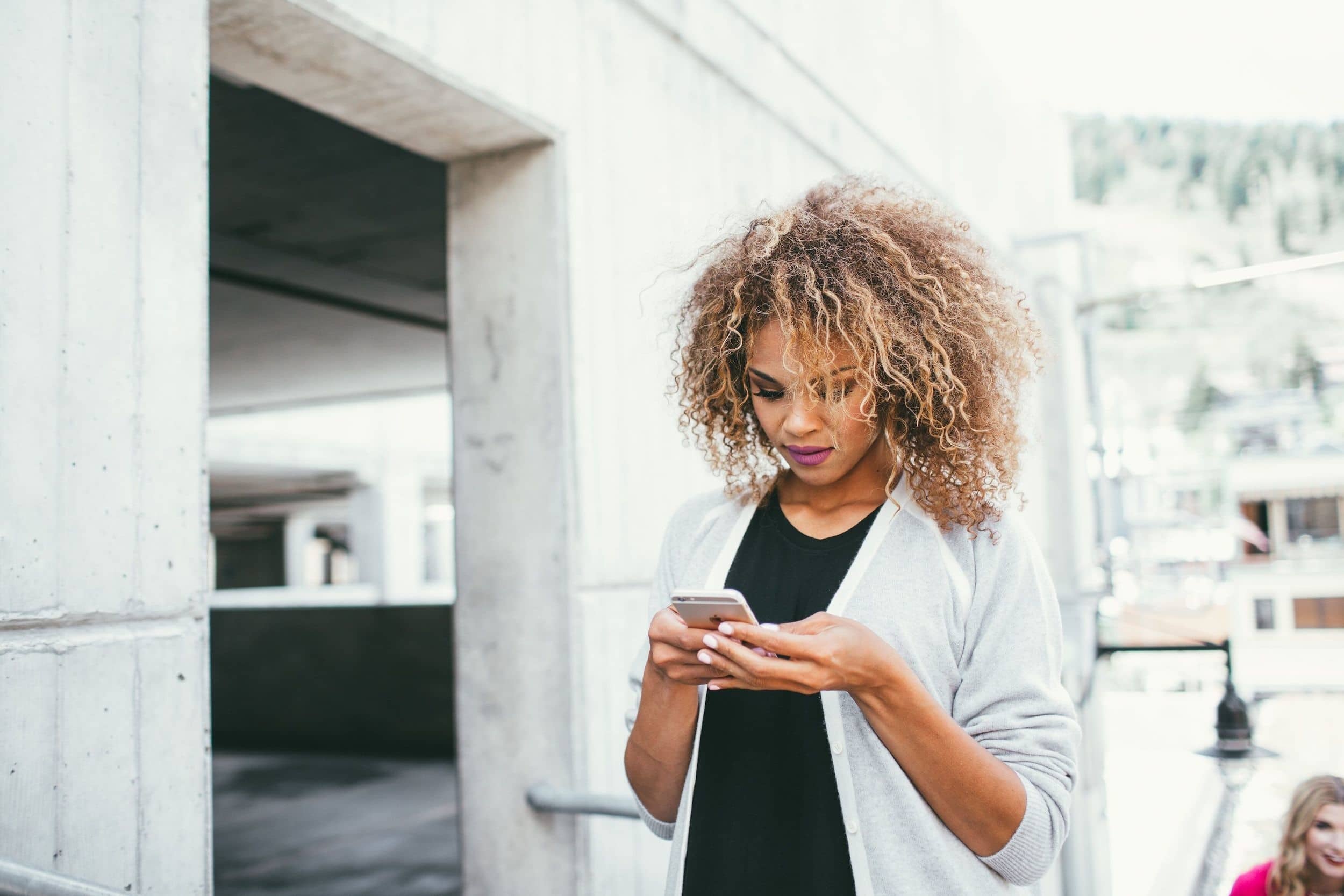 pregnant woman on her phone