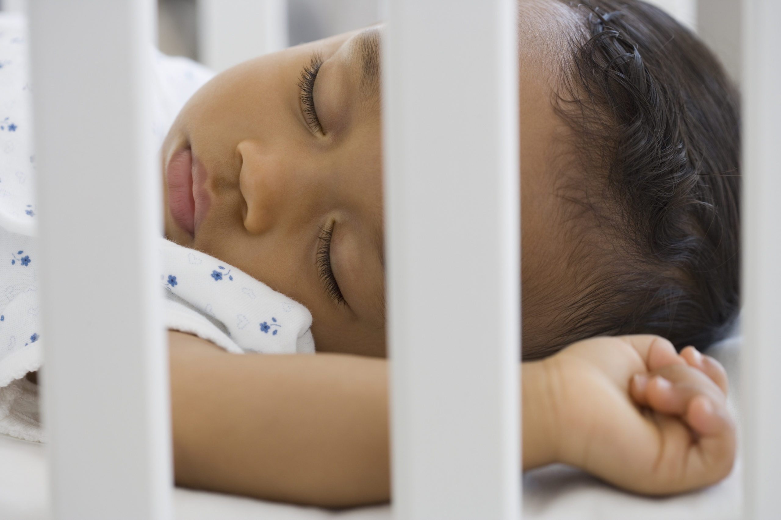 baby sleeping in a crib