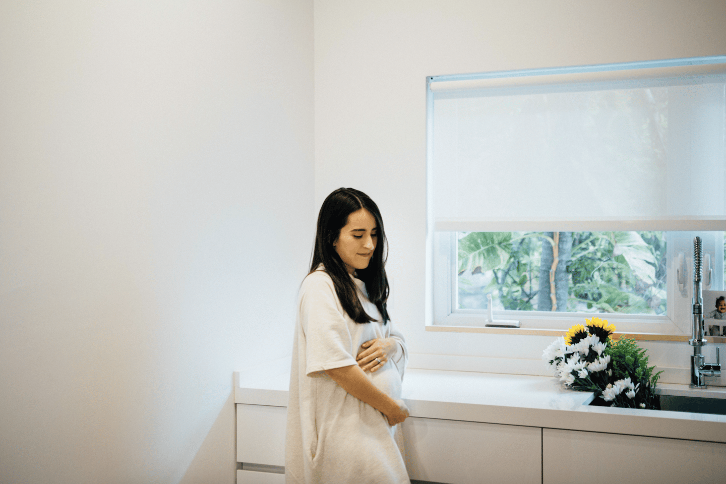 woman holding belly