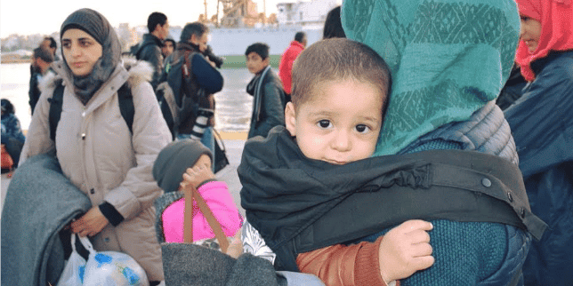 mom wearing baby in a carrier