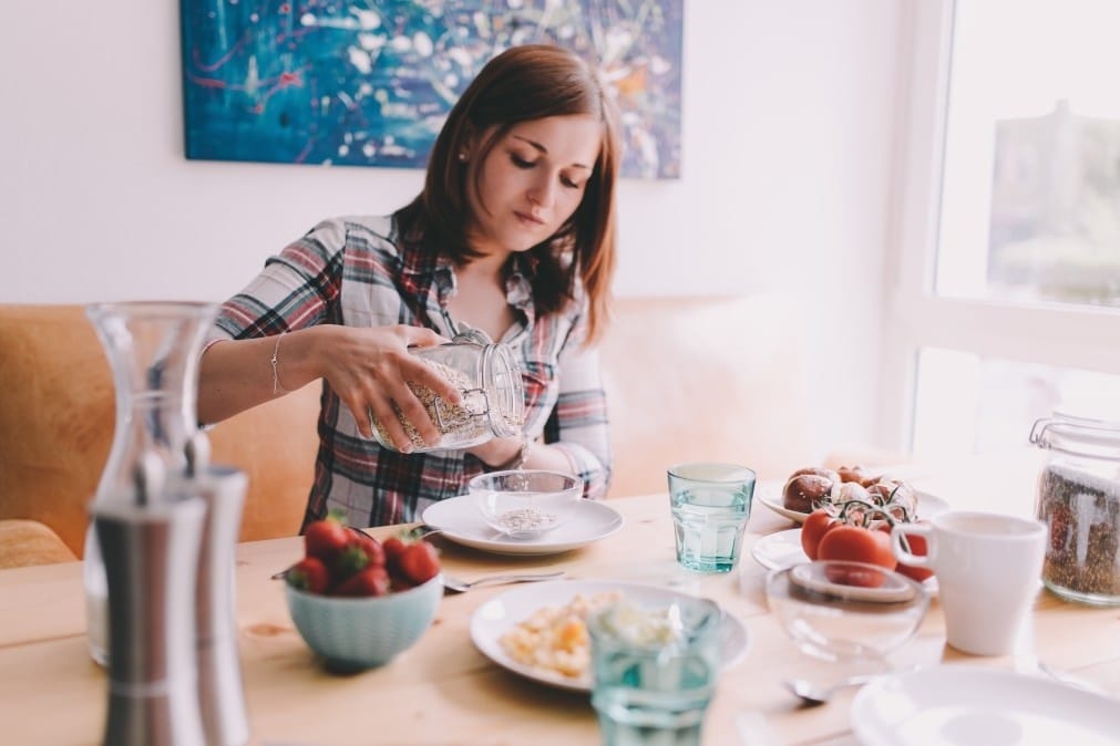 woman eating breakfast at the table