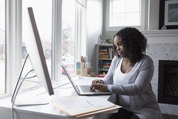 woman working on a laptop in an office