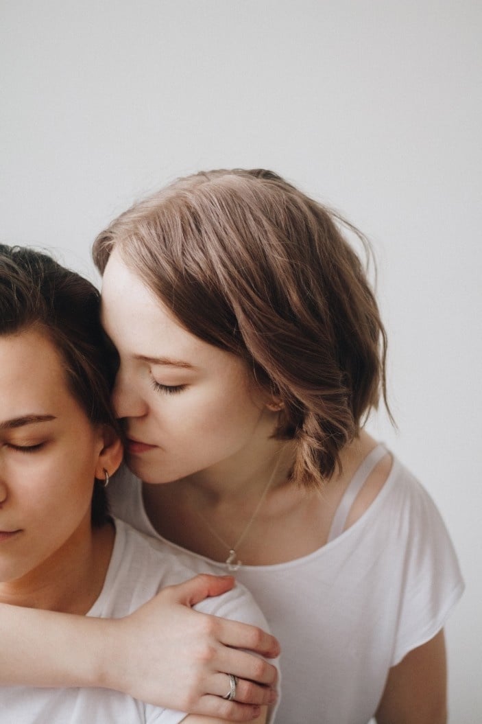 woman snuggling into partners head