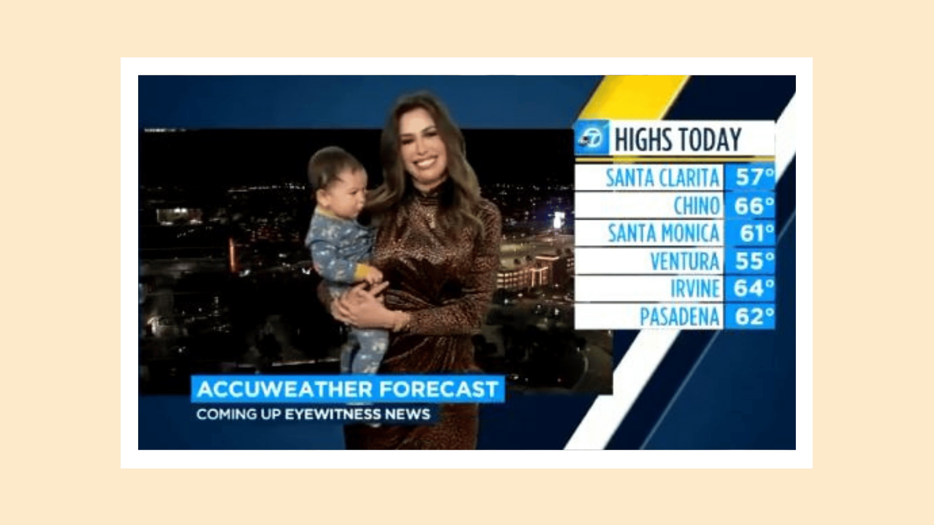 mom holding toddler while reporting the news on live tv