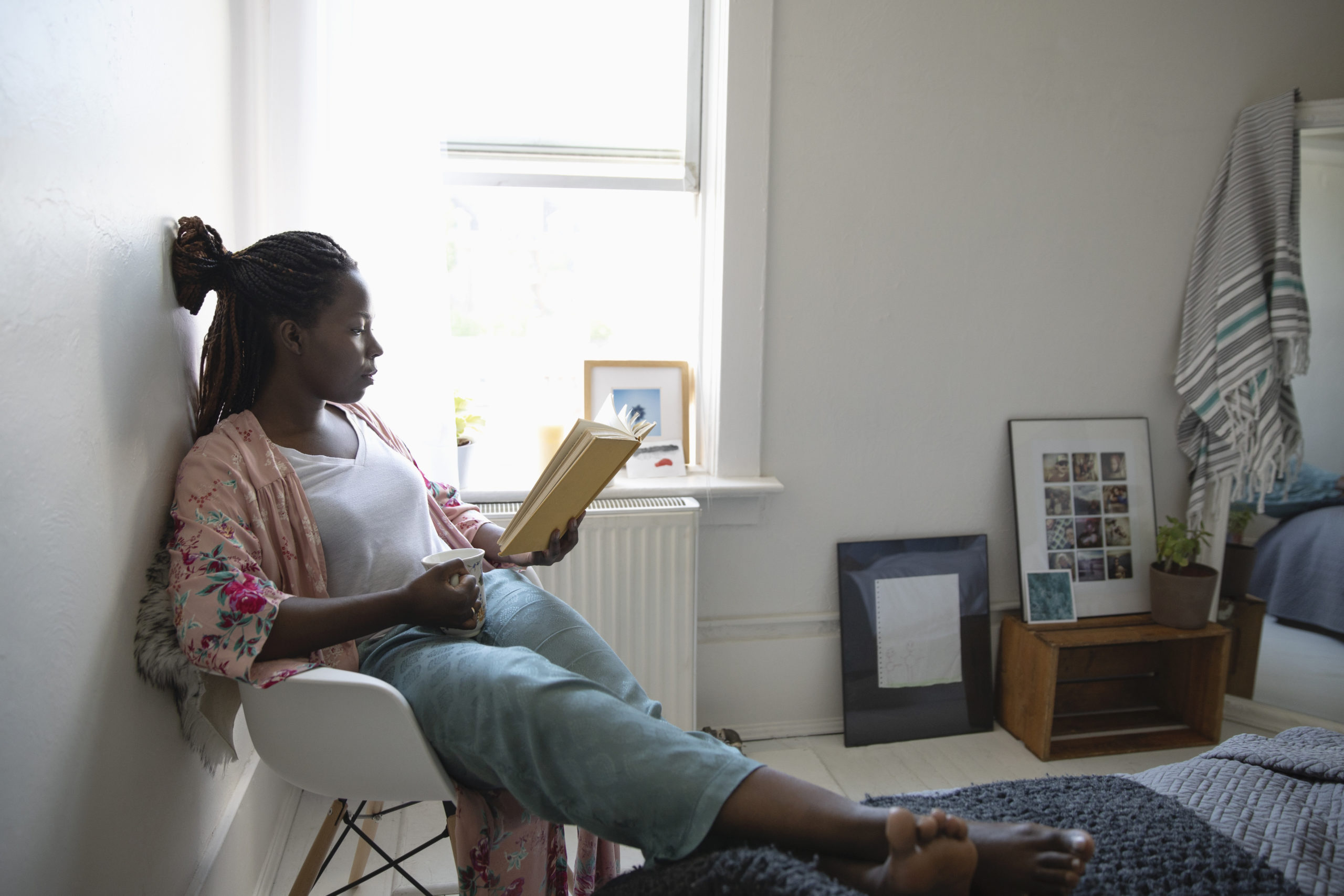 introvert parent sitting by herself and reading