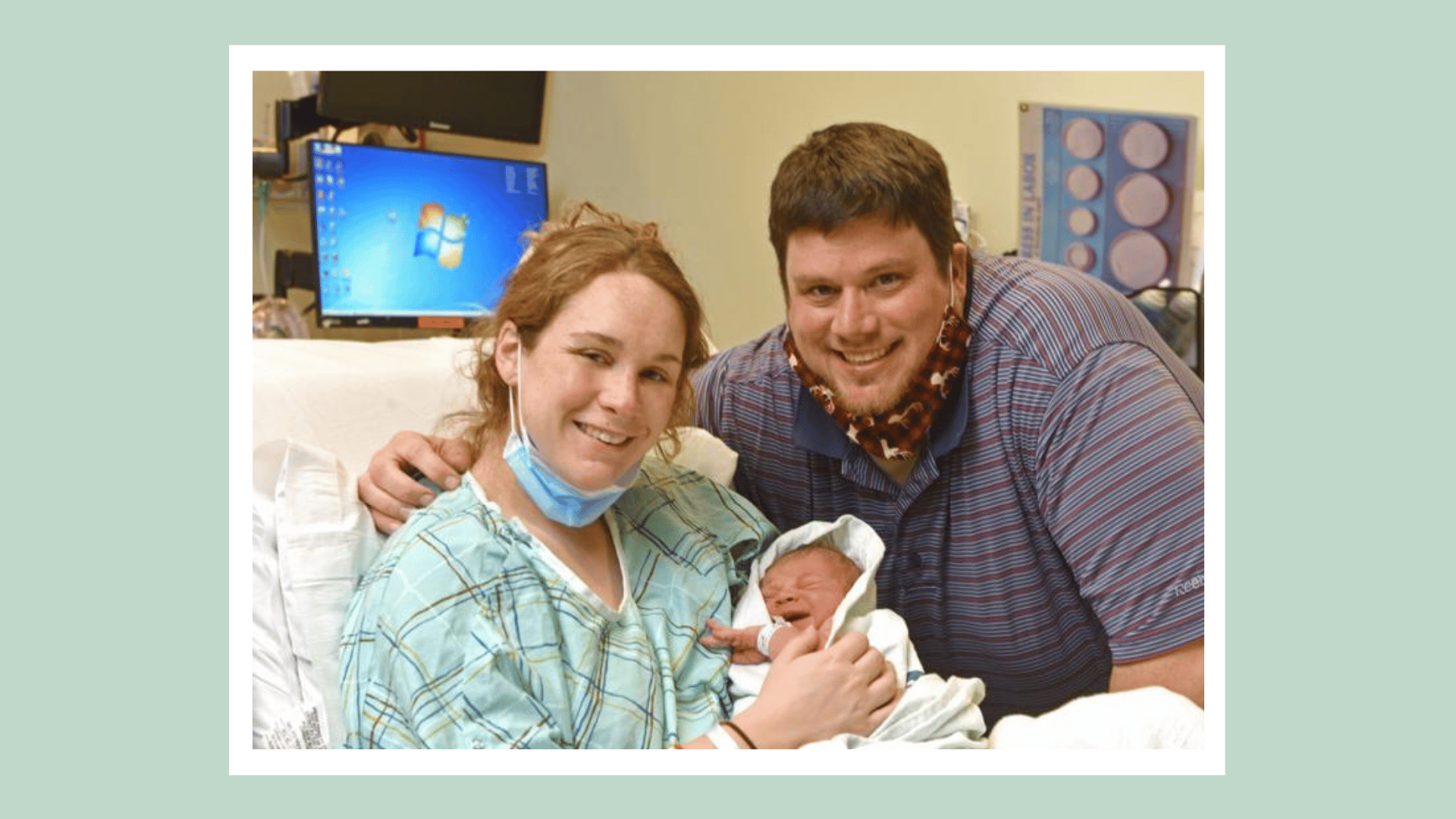 mom and dad holding newborn baby in the hospital