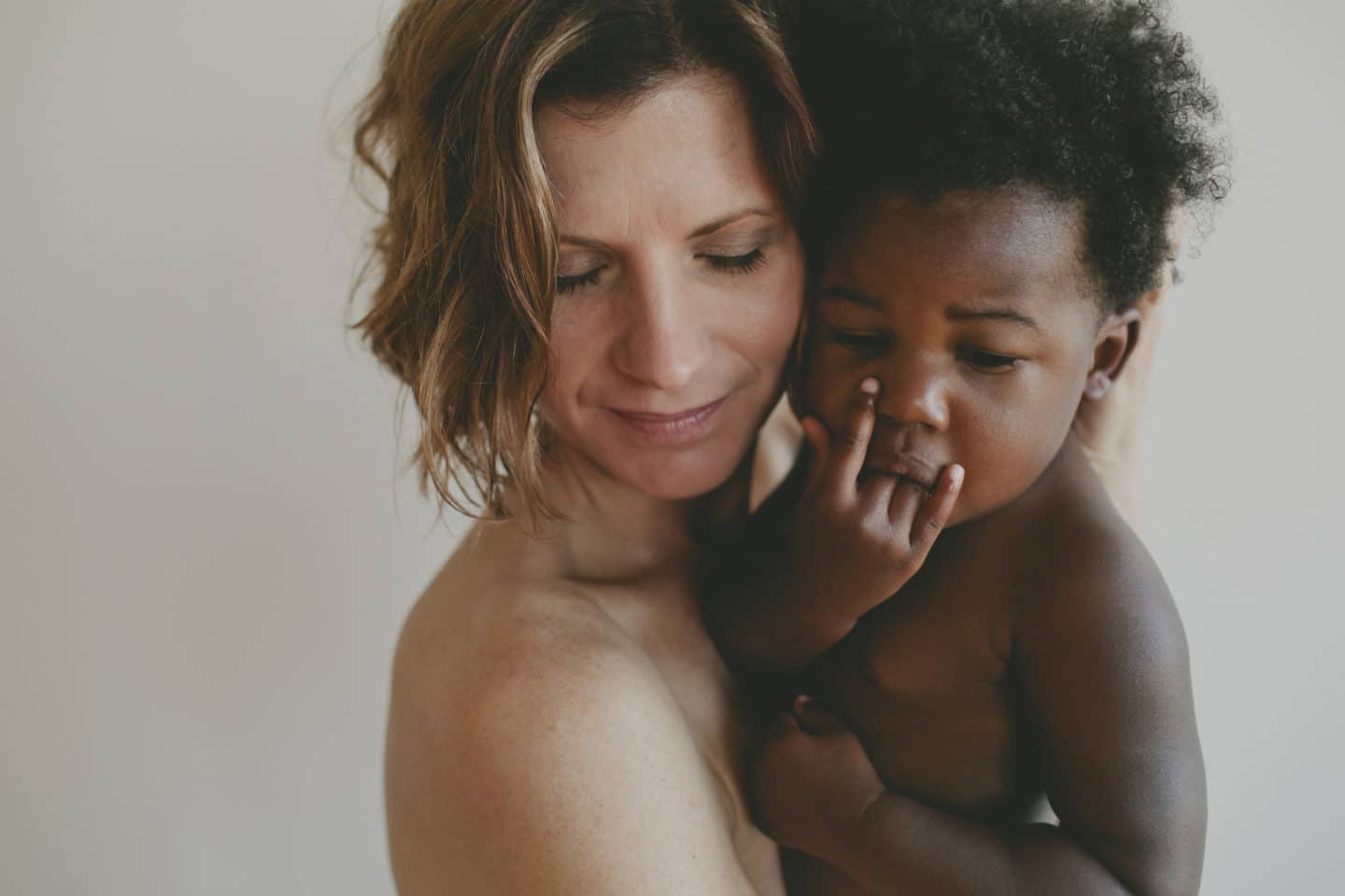 mom holding son