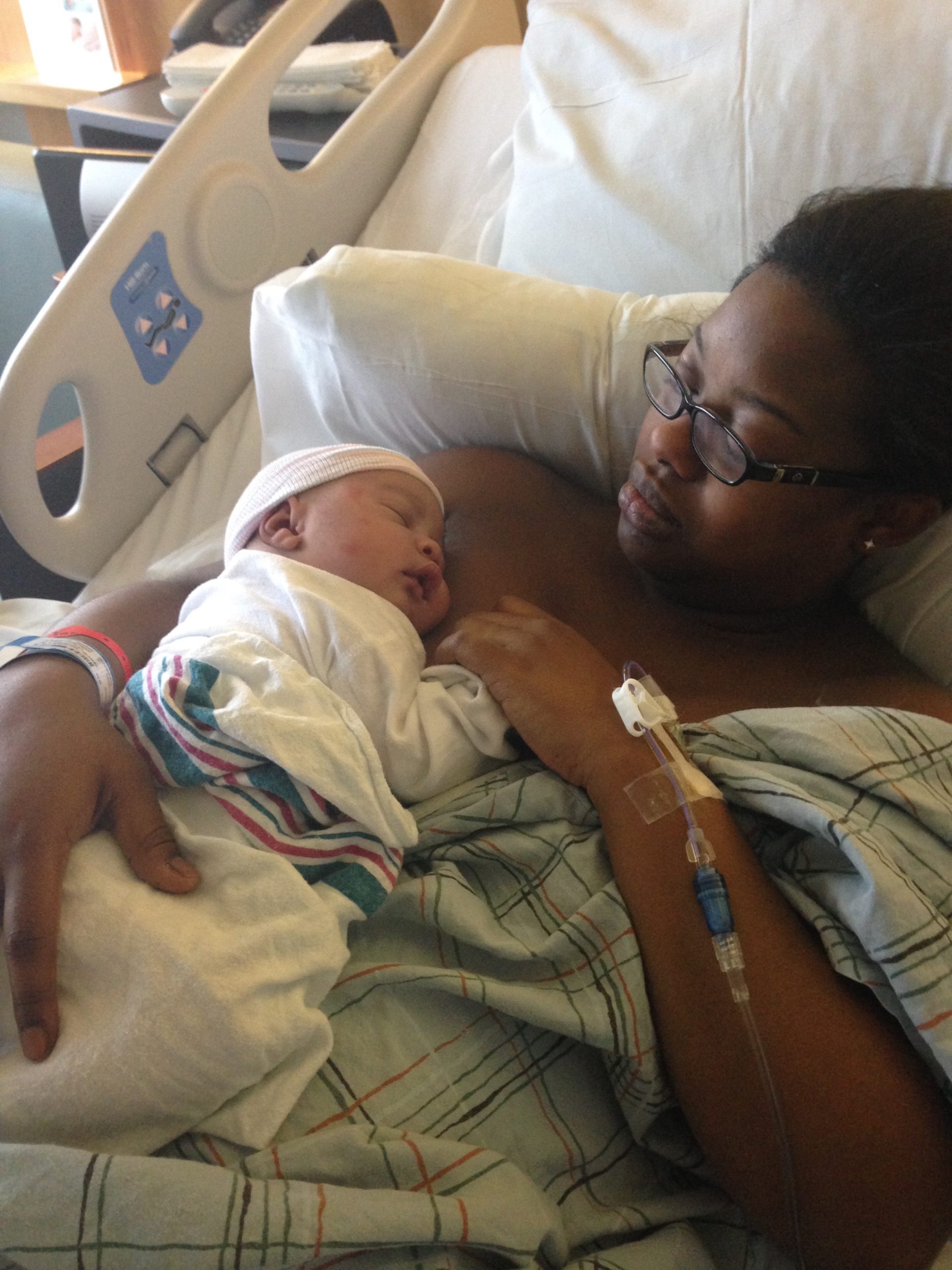 mom delivering baby by scheduled second C-section