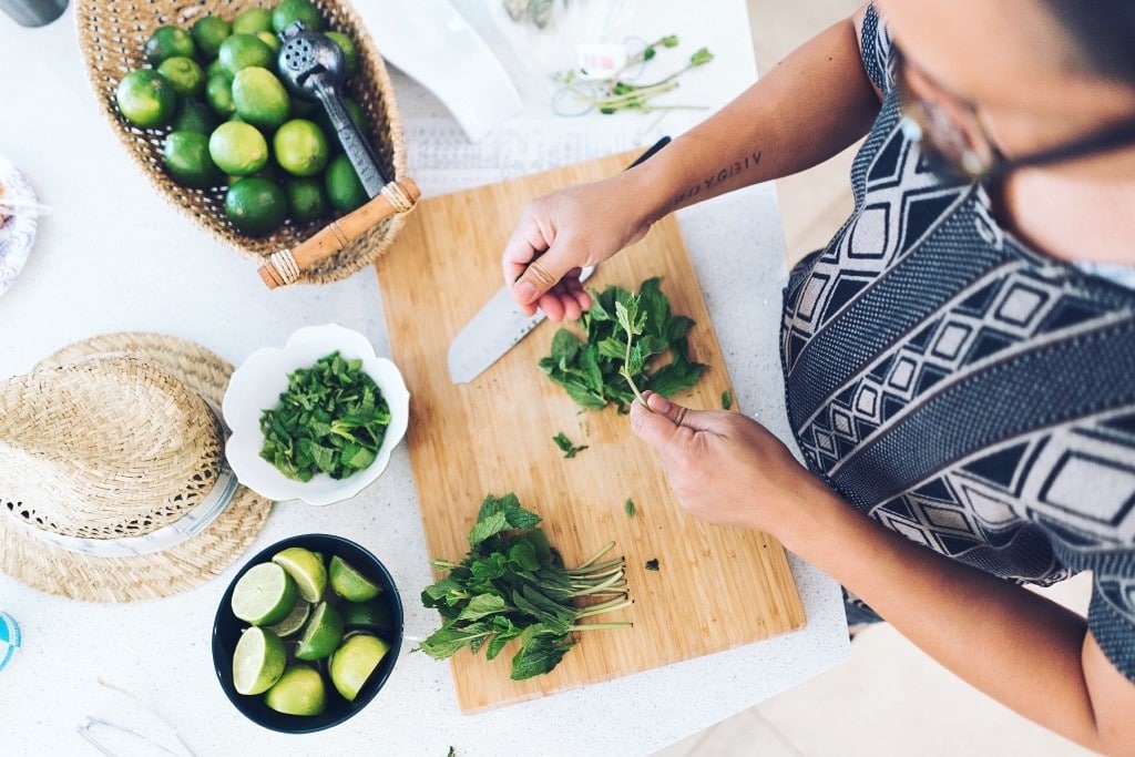 woman cutting brussel sprouts