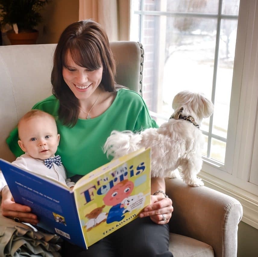 mom reading a book to a child