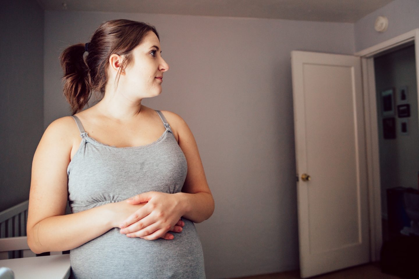 pregnant woman holding belly