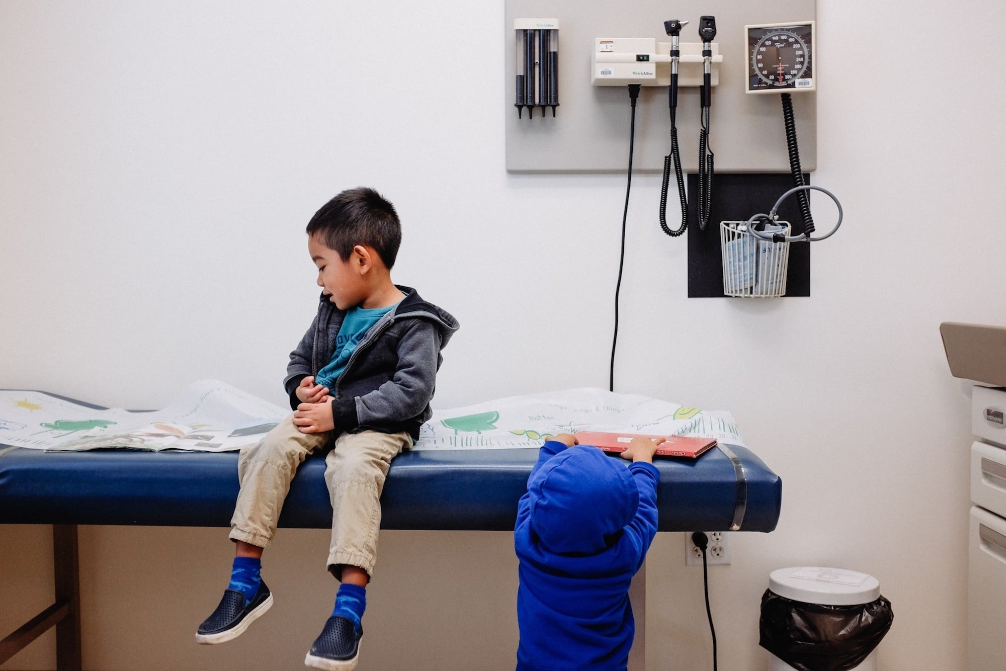 little boy sitting at the doctors office