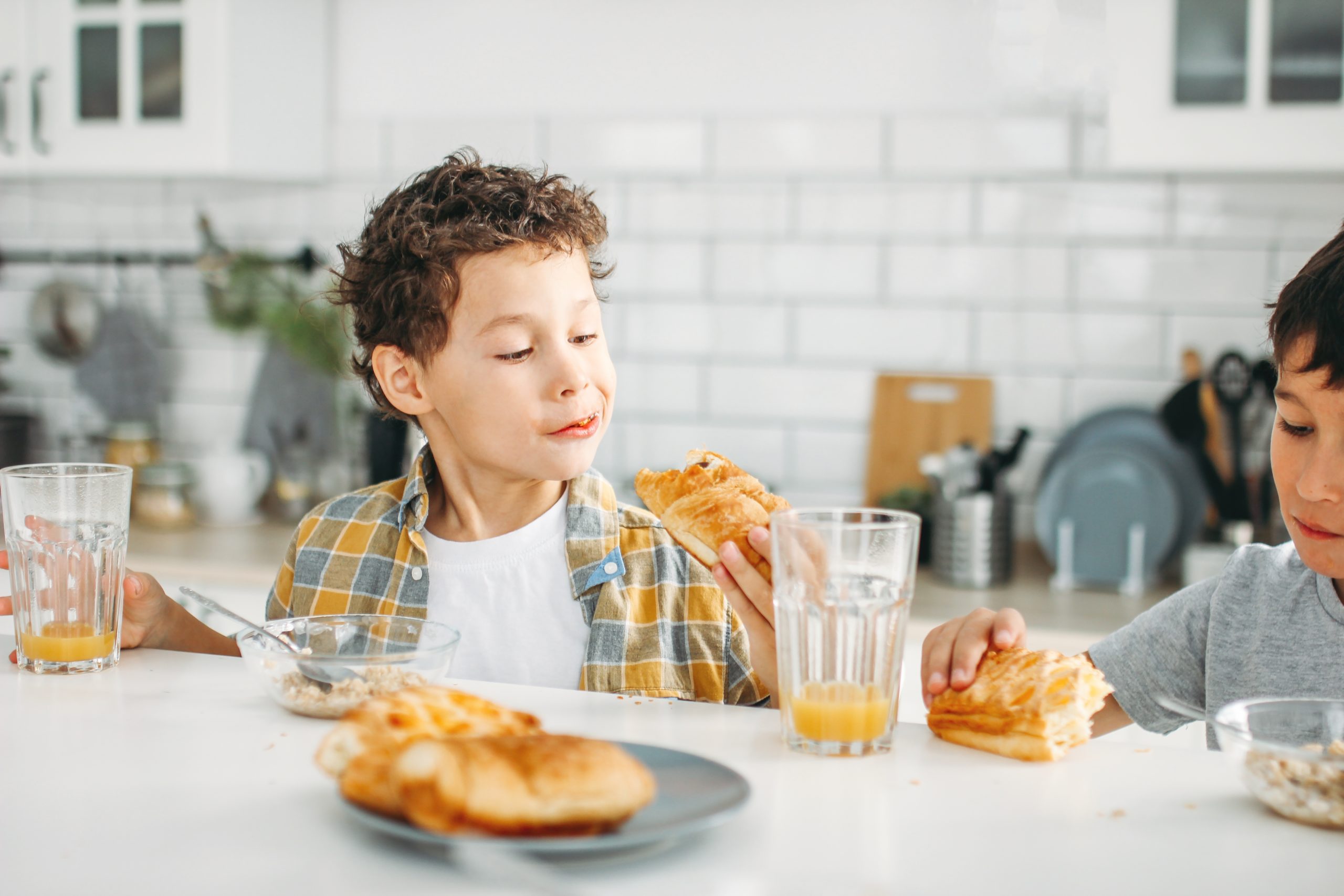 child eating breakfast at the kitchen table- picky eater
