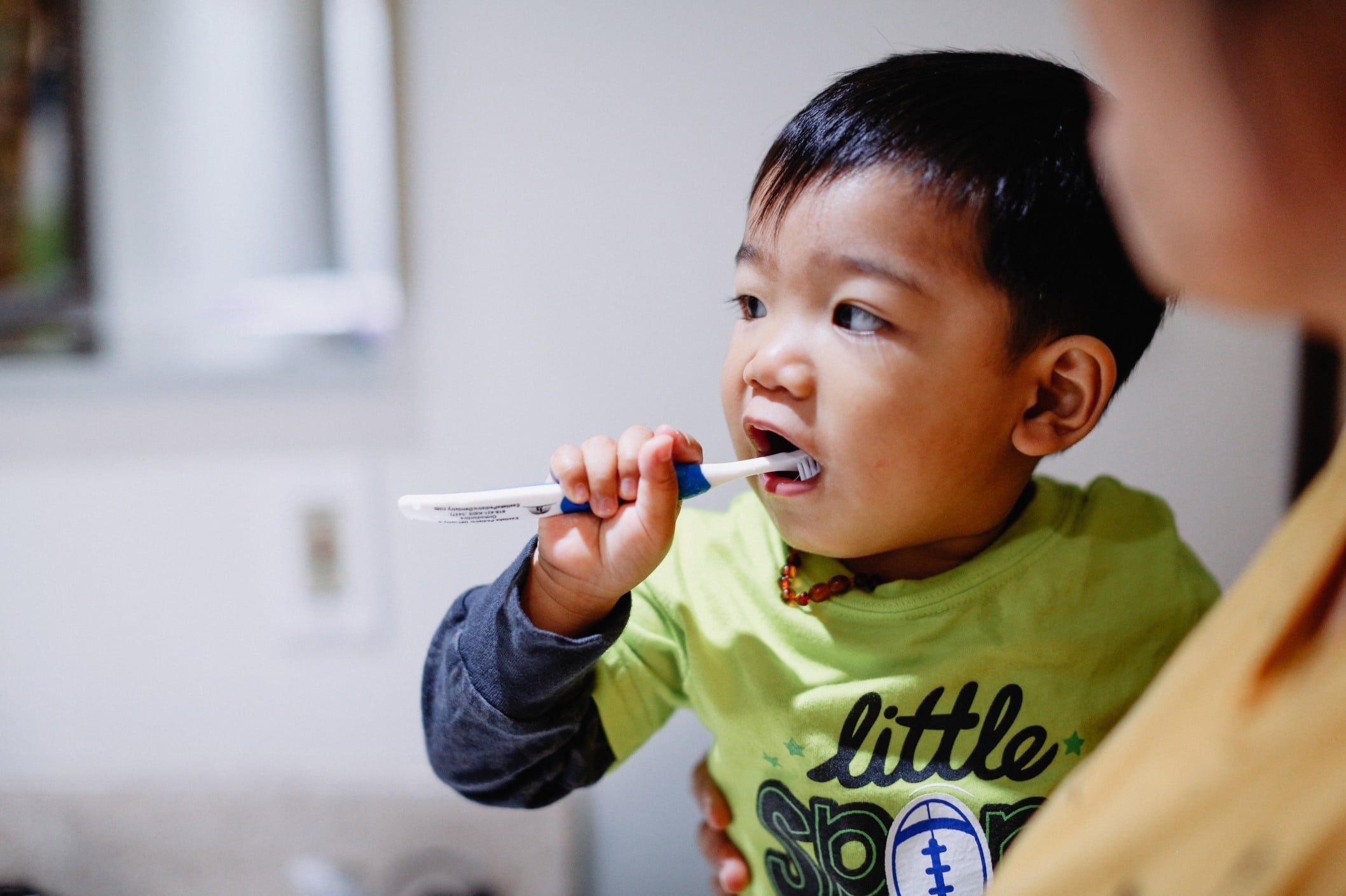 toddler brushing teeth