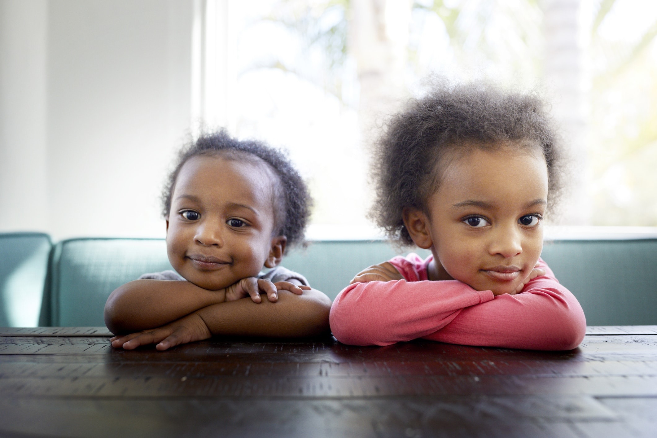 two black children sitting at a table- black daughters