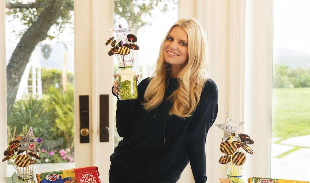 Jessica Simson holding a plant