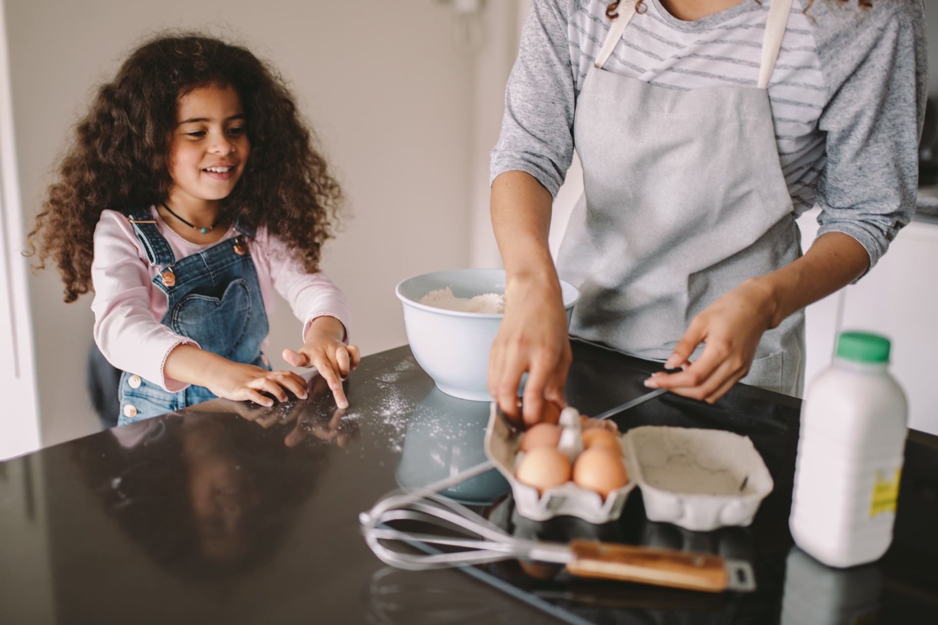 mom and child cooking together