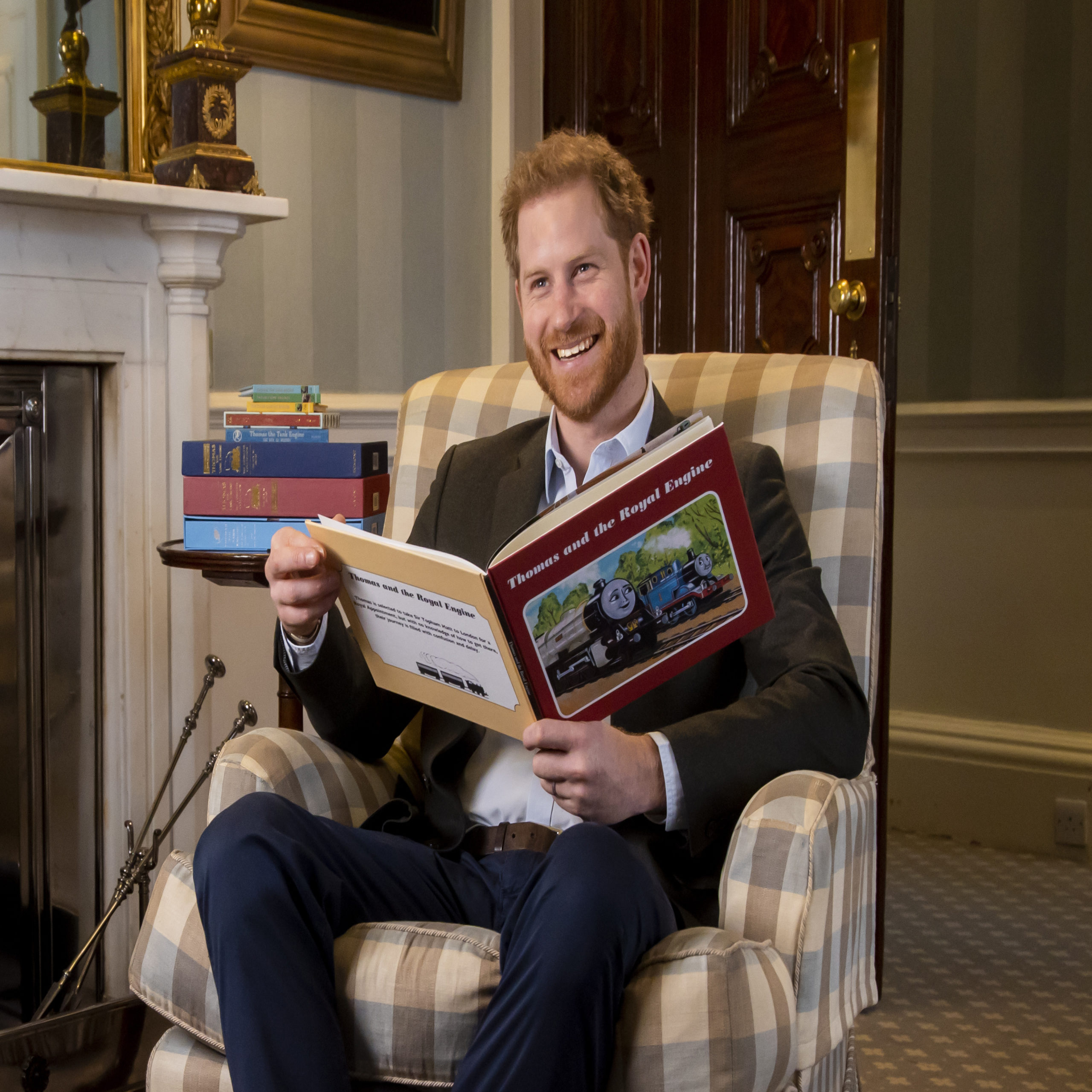 Prince Harry reading a children's book