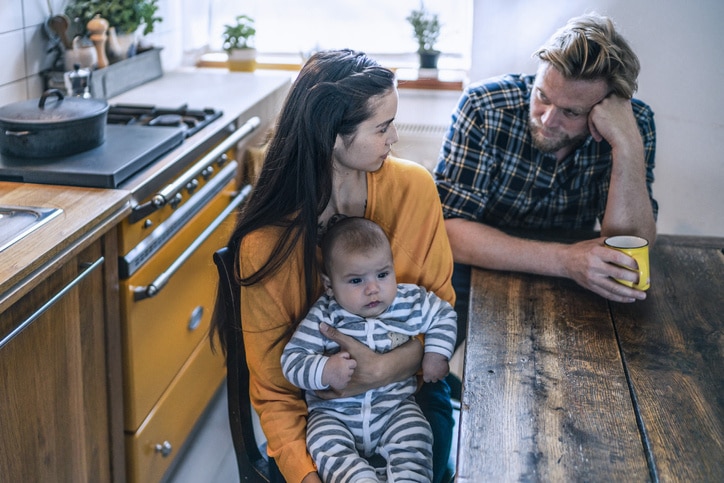 family sitting at a kitchen table